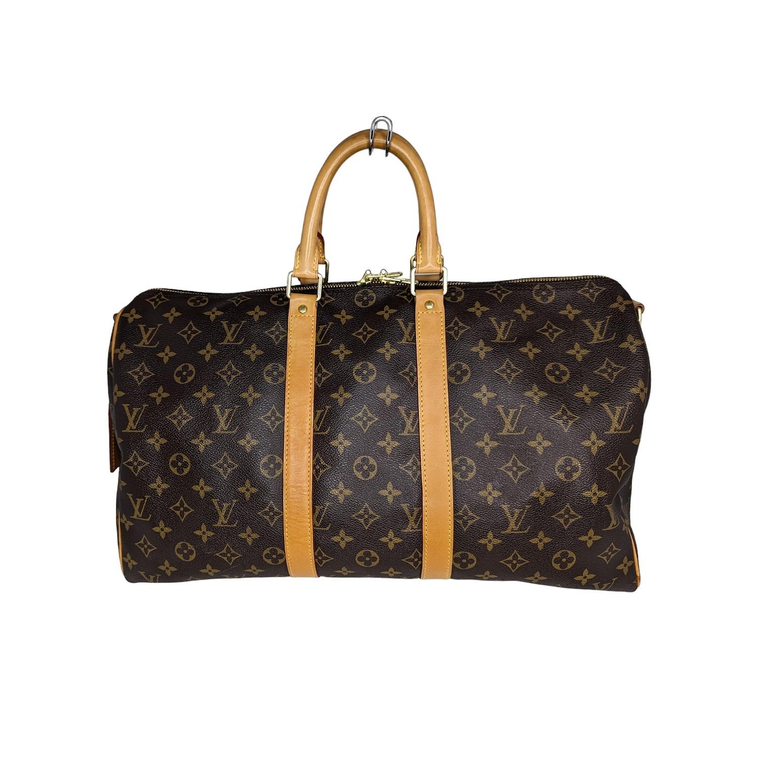 Lightweight and roomy, the Louis Vuitton Keepall Bandoulière 45 is the only way to travel in style. Its timeless shape and classic Monogram canvas are as fresh today as they ever have been. Current Retail $2,440.

Designer: Louis Vuitton
Material:
