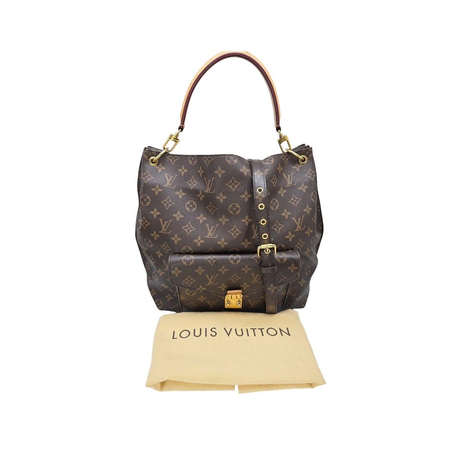 Expertly crafted and stylish, the Louis Vuitton 2014 Monogram Canvas Metis Hobo Bag is the perfect blend of fashion and function. Made with durable Monogram coated canvas and cowhide leather trim, this bag features an exterior flap pocket with a