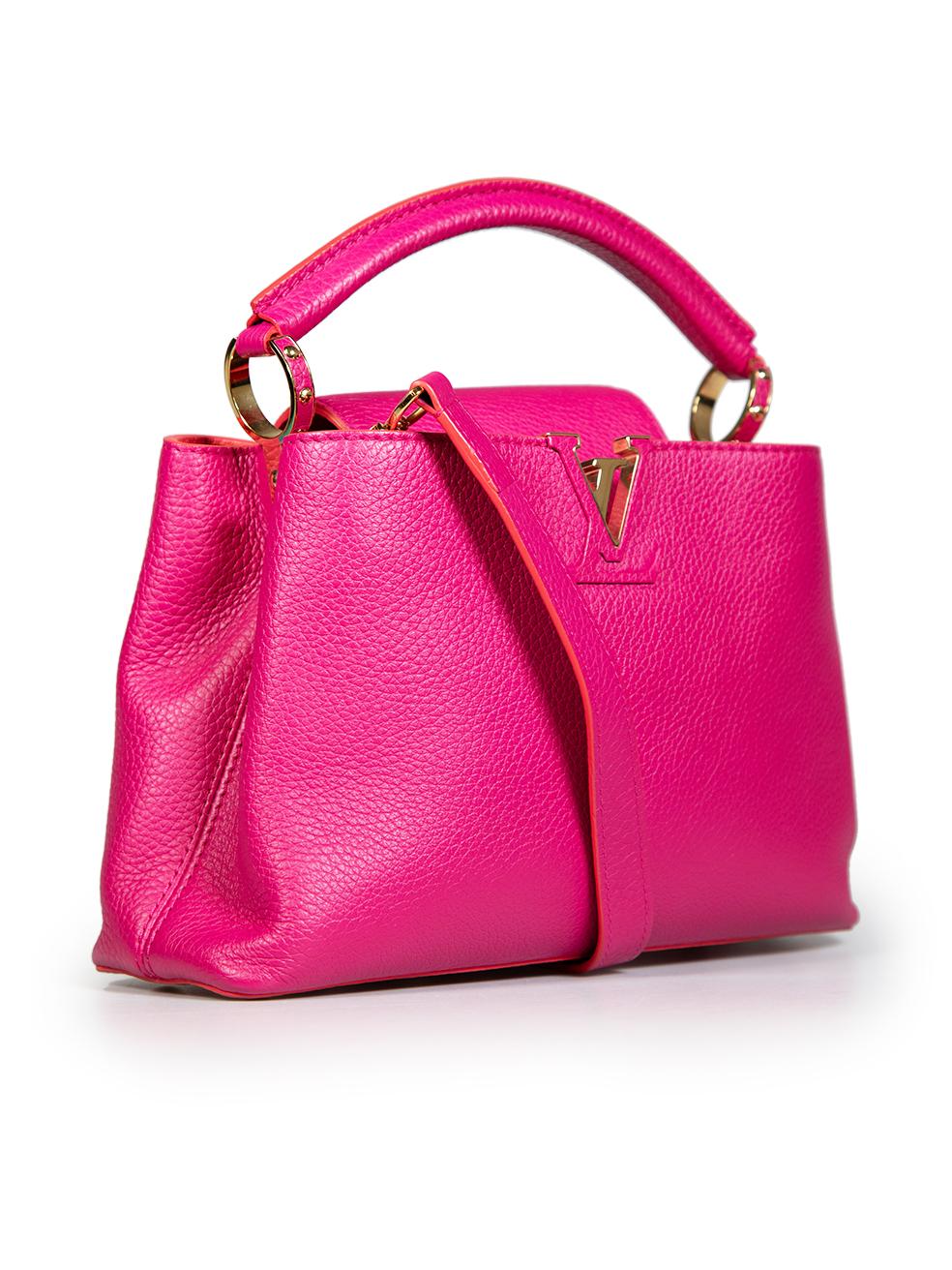 CONDITION is Never worn. No visible wear to bag is evident on this new Louis Vuitton designer resale item. This item comes with an original dust bag.
 Details
 Datecode - MI4125 (2015)
 Model: Capucines
 Pink
 Leather
 Top handle bag
 1x Top handle

