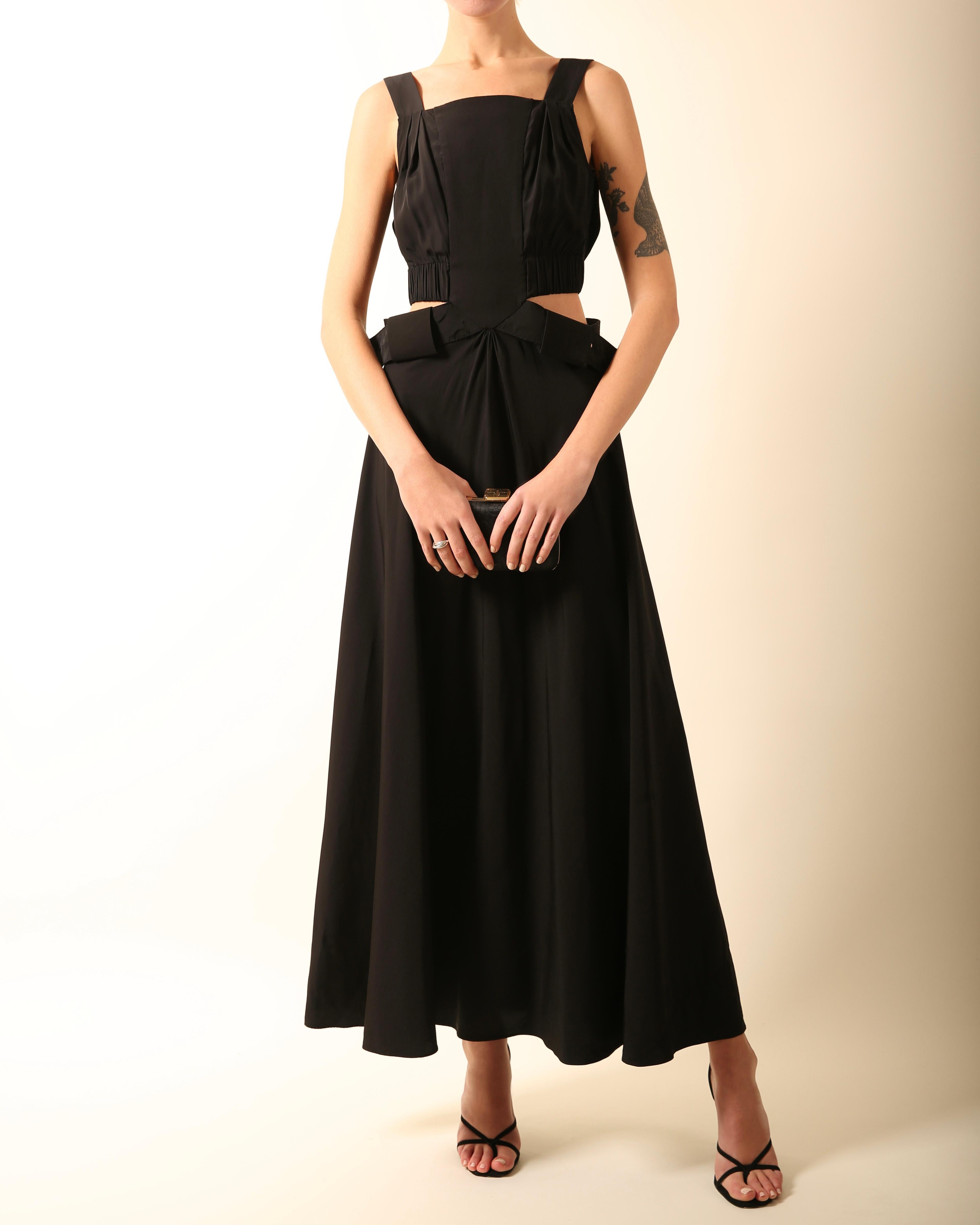 Louis Vuitton Resort 2016
Black maxi dress with cut out sides and back
Adjustable belted waist 
Popper and hook fastenings to the top and a concealed back zip to the skirt

FREE SHIPPING WORLDWIDE!!!

Composition:
50% viscose, 34% polyester, 16%