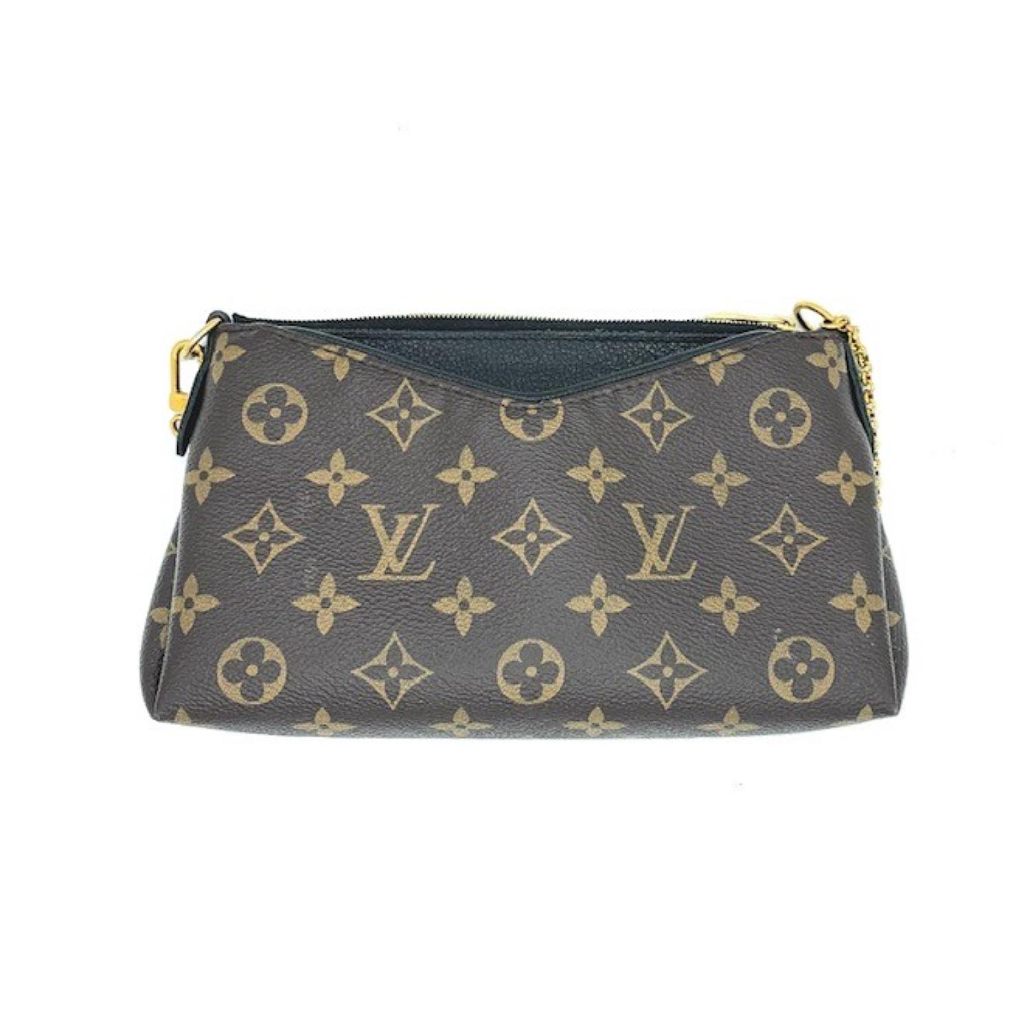 This chic shoulder bag is crafted of classic Louis Vuitton monogram on toile canvas, with textured black leather trim. The bag features a polished brass chain-link wristlet strap and an optional toffee brown leather shoulder strap. The top zipper