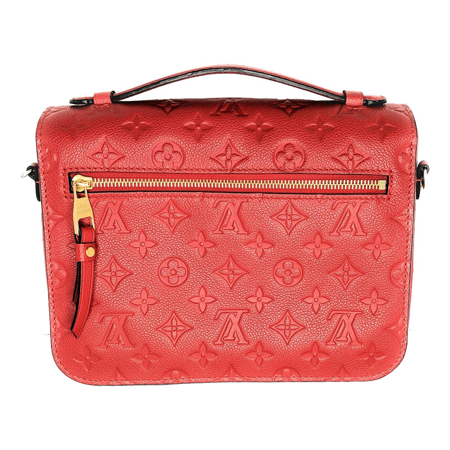 From the 2017 Collection. Scarlet Red Empreinte leather Louis Vuitton Pochette Metis with brass hardware, single flat top handle, single detachable flat shoulder strap with buckle adjustment, single exterior zip pocket at back, tonal and black