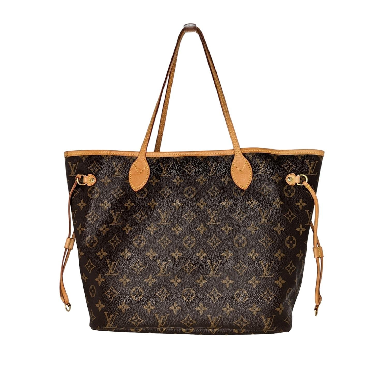 This stylish tote is crafted of classic Louis Vuitton monogram on coated canvas. It features vachetta cowhide leather trim, shoulder straps, and side cinch cords. The top is open to a beige fabric interior with a hanging zipper pocket. Retail price