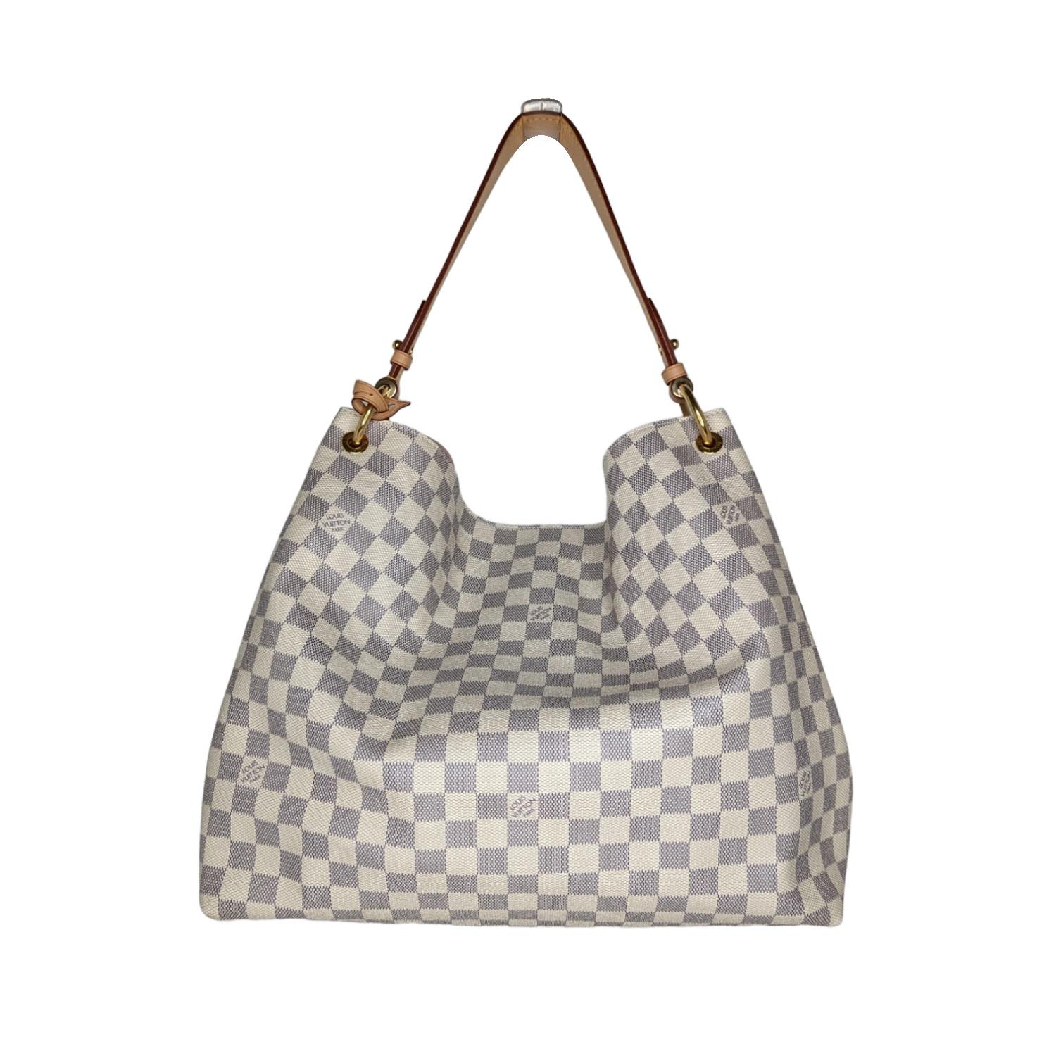The Graceful MM hobo in fresh Damier Azur canvas is an extra-roomy yet lightweight bag to carry every day. Natural leather detailing and shiny gold-tone hardware add a refined, signature touch. The body-friendly design combines with a supple, flat