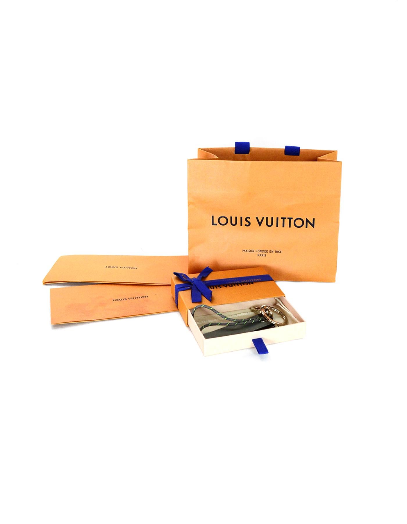 Louis Vuitton 2018 Grey LV Monogram Titanium Fluo Tab Bag Charm/Key Ring Unisex

Made In: Italy
Year of Production: 2018
Color: Grey
Materials: Leather and metal 
Hallmarks:  