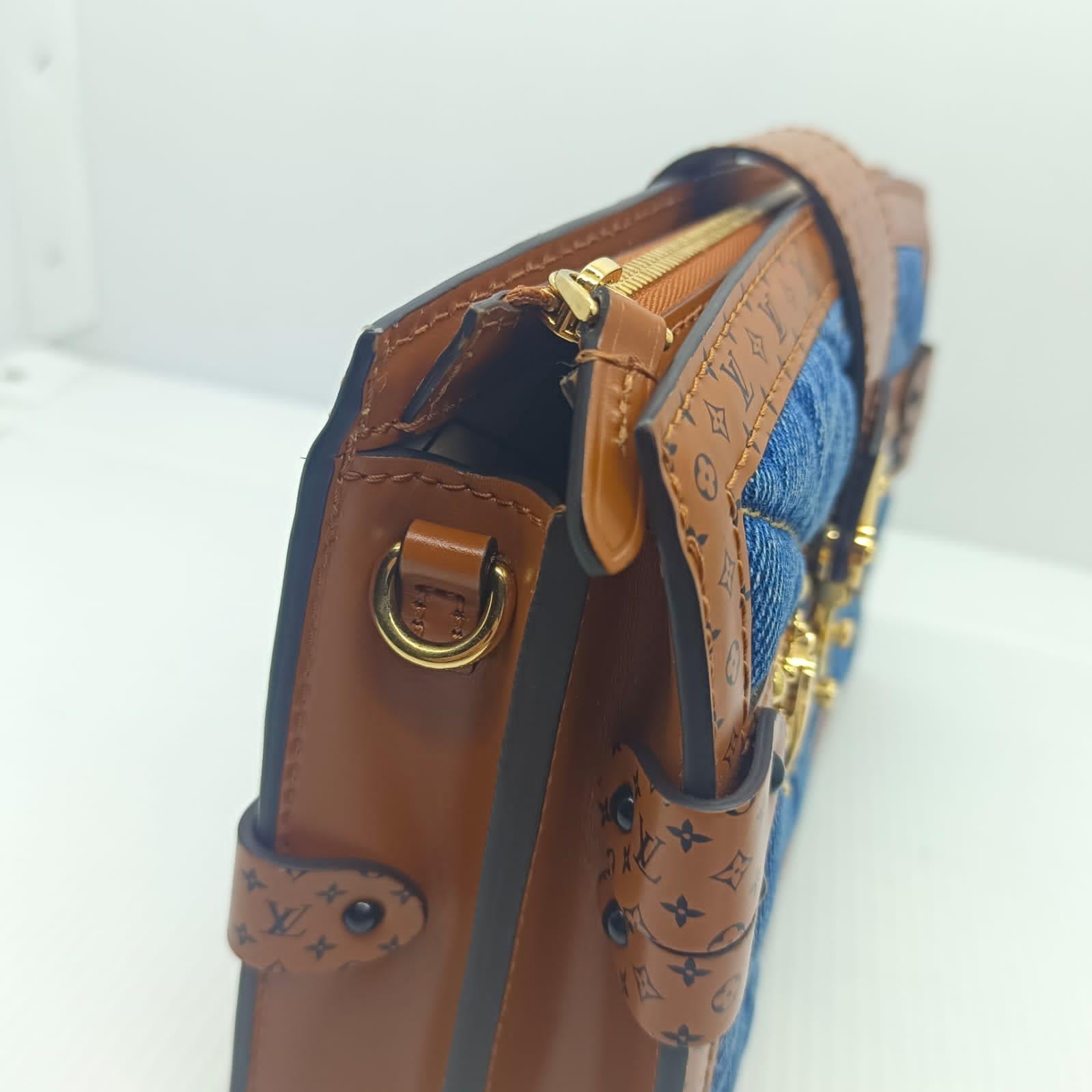 Louis Vuitton 2019 malletage denim trunk clutch bag. Overall in excellent condition, the only minor is scratches on the s lock hardware due to wear. No marks on the leather lining. Whimsy mini monogram design on the leather trims. Comes with its