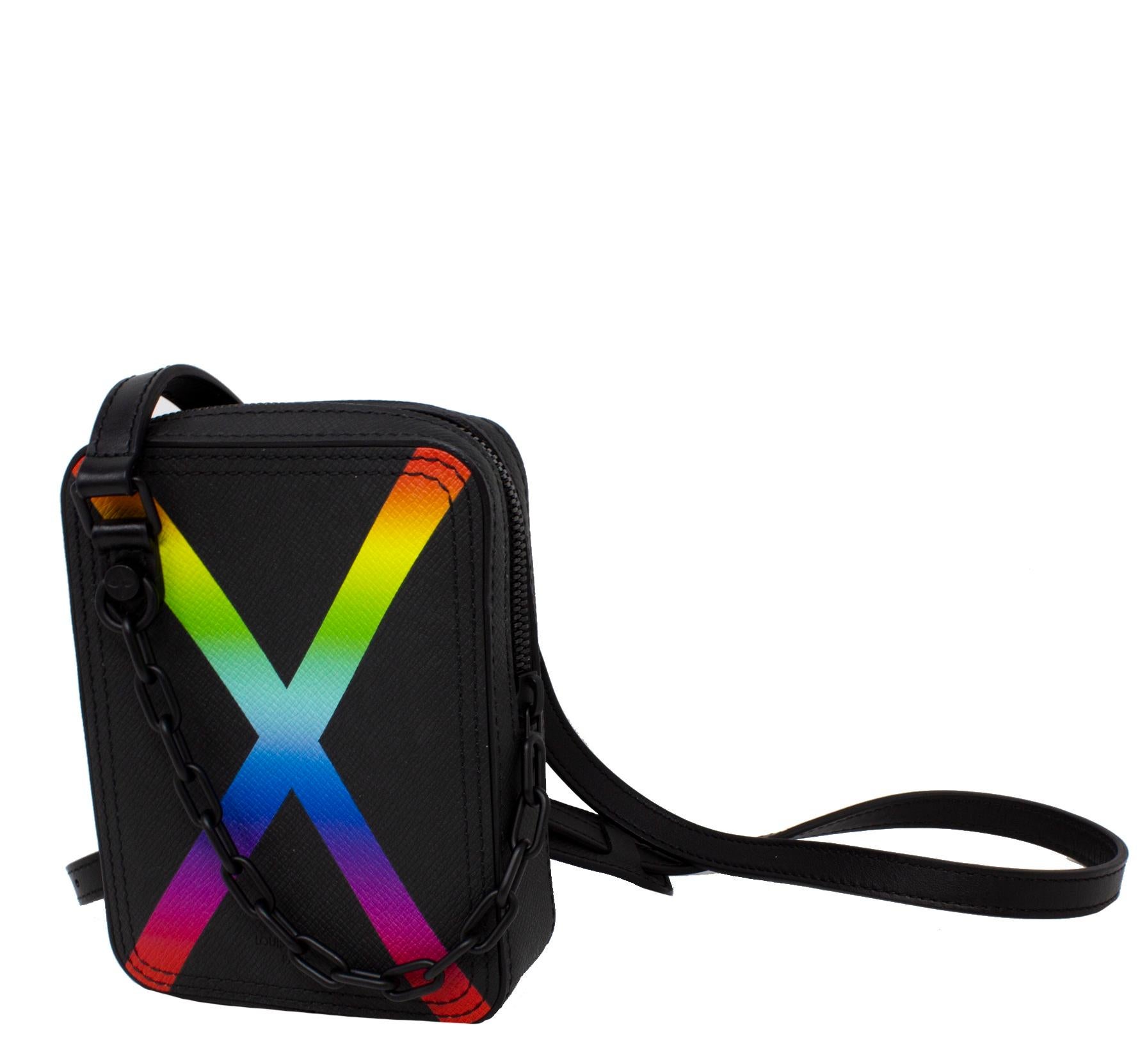 Super fun interpretation of the classic Danube silhouette by Virgil Abloh. This Louis Vuitton Messenger Bag is crafted in black grained leather with a graphic rainbow print and edgy black tonal hardware. The zip closure is connected to a black chain