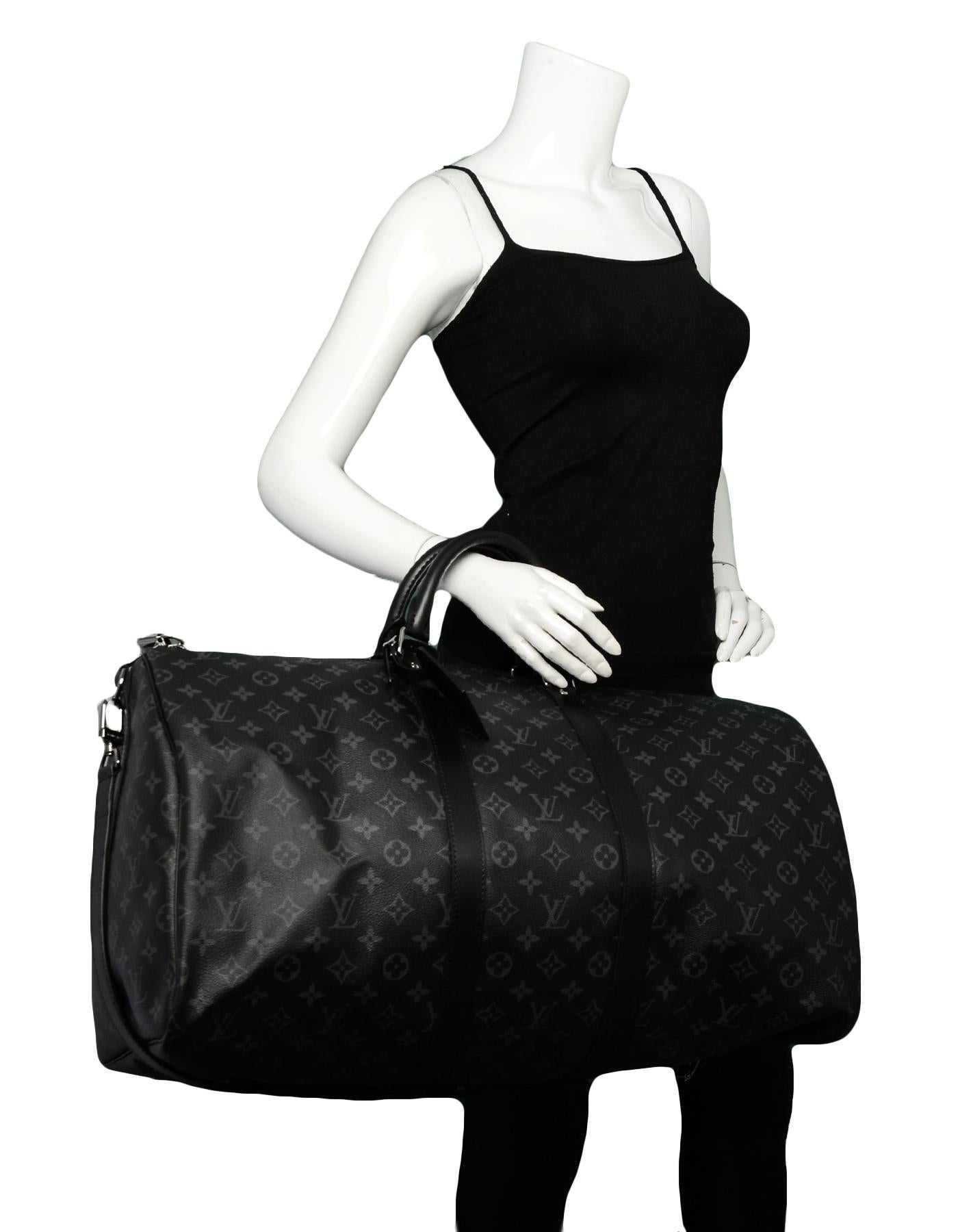 Louis Vuitton 2019 Monogram Eclipse Canvas Keepall Bandouliere 55 Duffle Bag

Made In: France
Year of Production: 2019
Color: Black
Hardware: Silvertone hardware
Materials: Coated Canvas
Lining: Black textile lining
Closure/Opening: Top zip