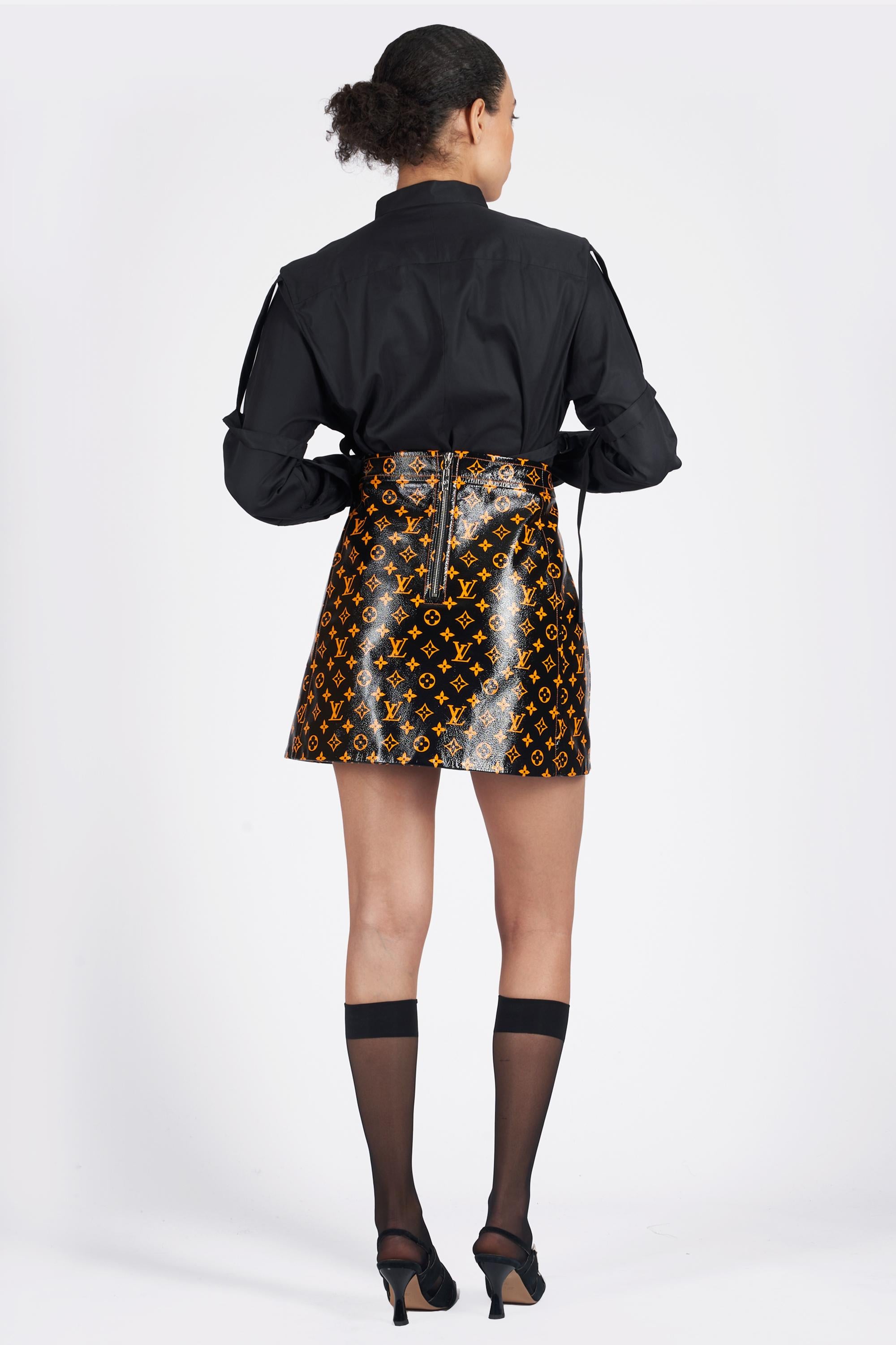 We are excited to present this Louis Vuitton 2020 patent leather mini skirt. Features monogram print all over in orange, a line fit and zip on back for closure. In excellent vintage condition. As seen on Sophie Turner and Hailey Bieber. Authenticity