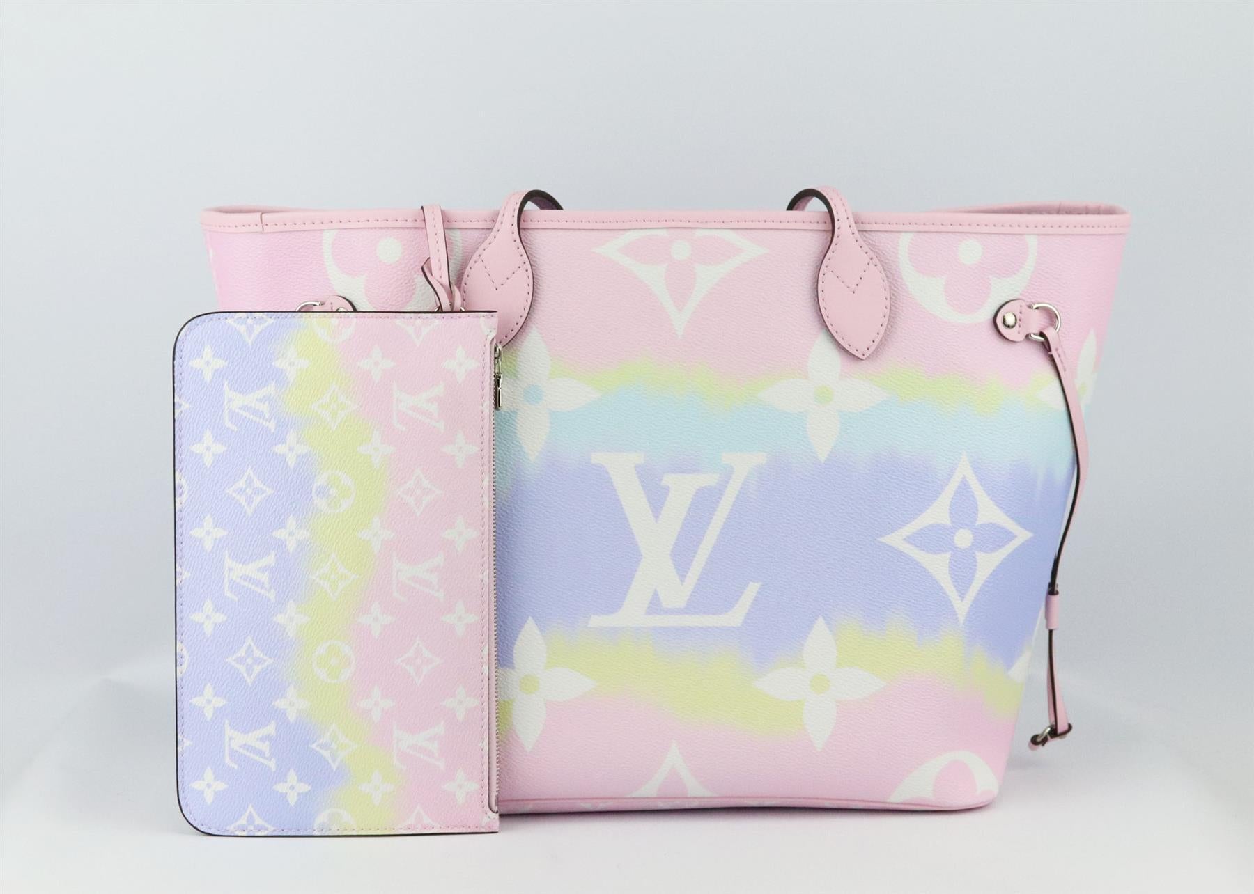 This beautiful 2020 Louis Vuitton ‘Neverfall’ MM Escale tote bag has been made from pink, blue, yellow and purple tie-dyed coated canvas and leather exterior with blue canvas interior, this piece is decorated with the brand’s iconic monogram print