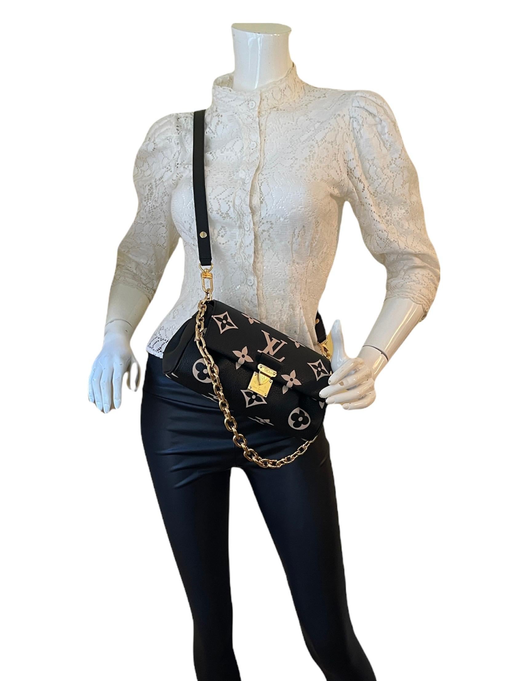 Louis Vuitton Black/Beige Empreinte Monogram Giant Favorite MM Bag.  Features two detachable straps- one chain shoulder and one adjustable leather that can be worn on the shoulder or crossbody (see measurements)

Made In: France
Year of Production: