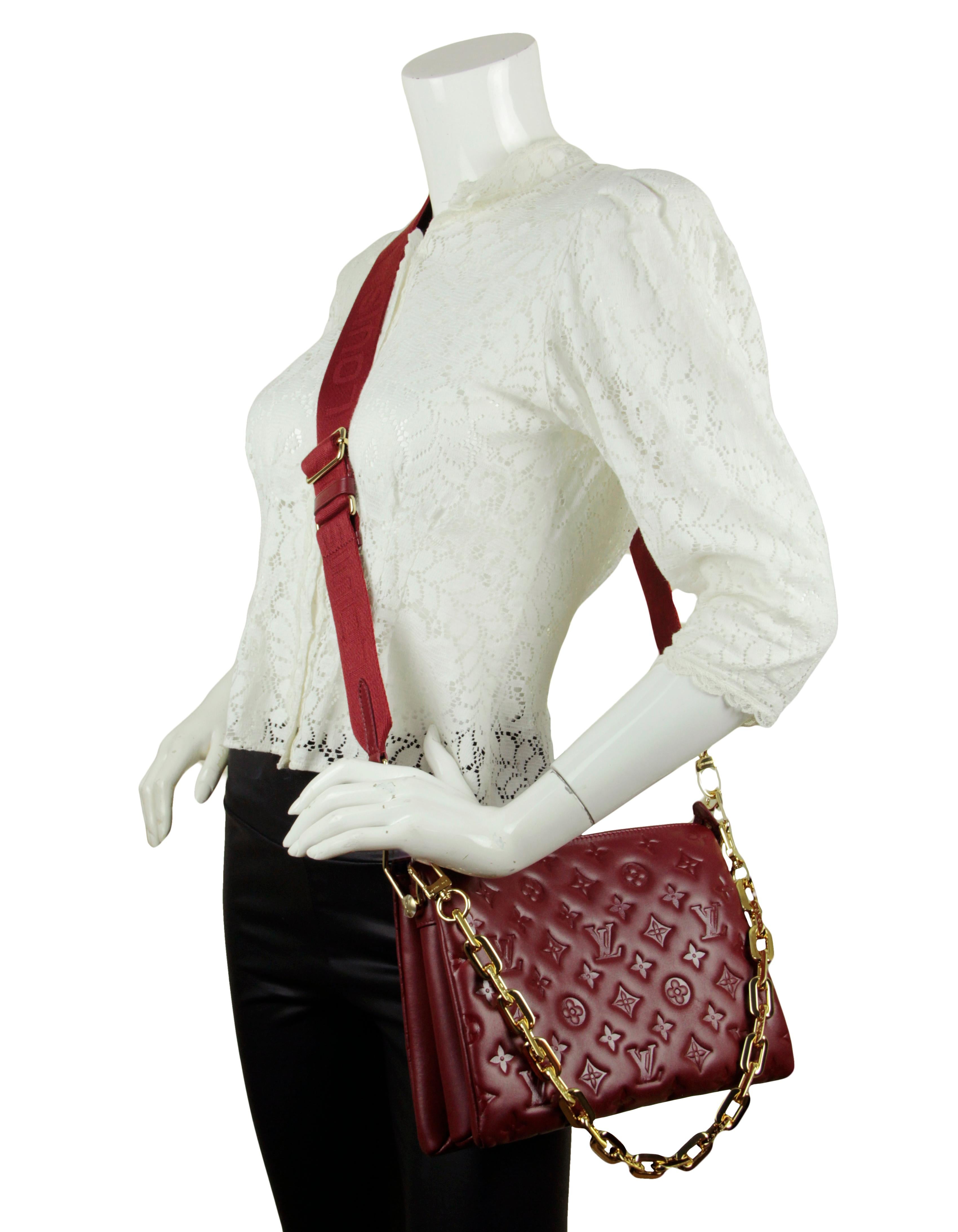 Louis Vuitton Wine Lambskin Leather Embossed Monogram Coussin PM Bag.  Features adjustable canvas strap allowing for crossbody or shoulder carry, and chain strap for baguette and under-arm carry.
Made In: France
Year of Production: 2021
Color: