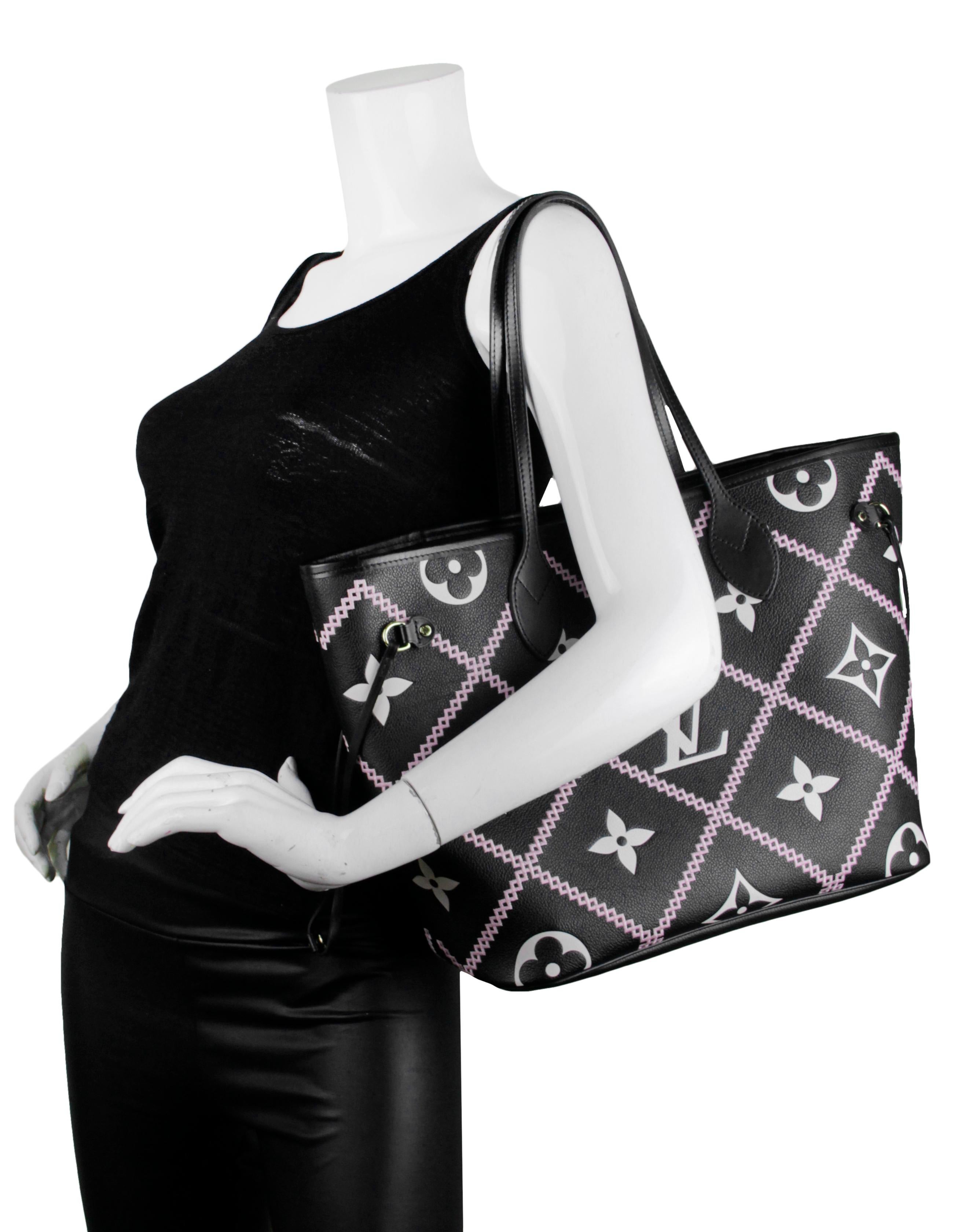 Louis Vuitton 2022 Black Empreinte Leather Monogram Giant Broderies Neverfull MM Tote Bag

Made In: Spain
Year of Production: 2022
Color: Black and white with pink embroidery
Hardware: Goldtone
Materials: Embroidered embossed supple grained cowhide