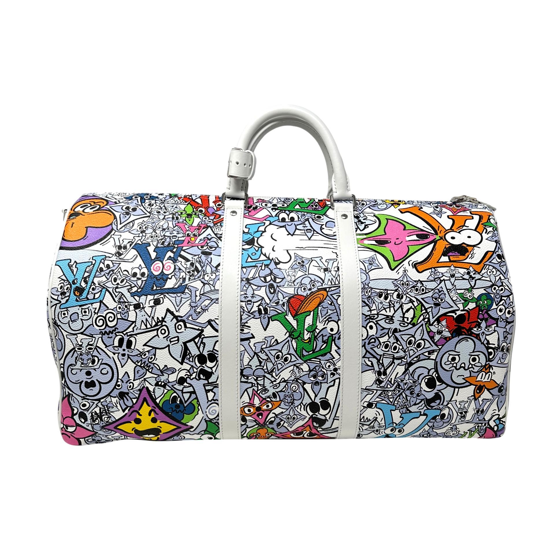 Description: This is a gorgeous Louis Vuitton 2023 Comics White & Multi-Color Monogram Keepall Bandouliere 50. This Limited Edition luggage in the monogram Comics Print from the 2023 Spring Collection by Nicolas Ghesquiere. The spacious interior is