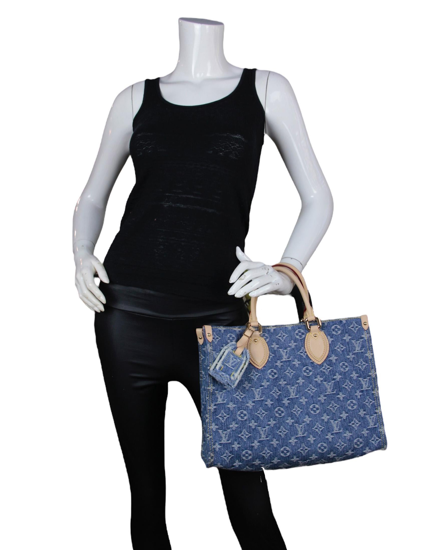 Louis Vuitton Denim Monogram OnTheGo MM Tote Bag

Made In: France
Year of Production: 2024
Color: Blue denim
Hardware: Goldtone
Materials: Denim global organic textile-certified cotton canvas with vachetta leather trim
Lining: Denim global organic