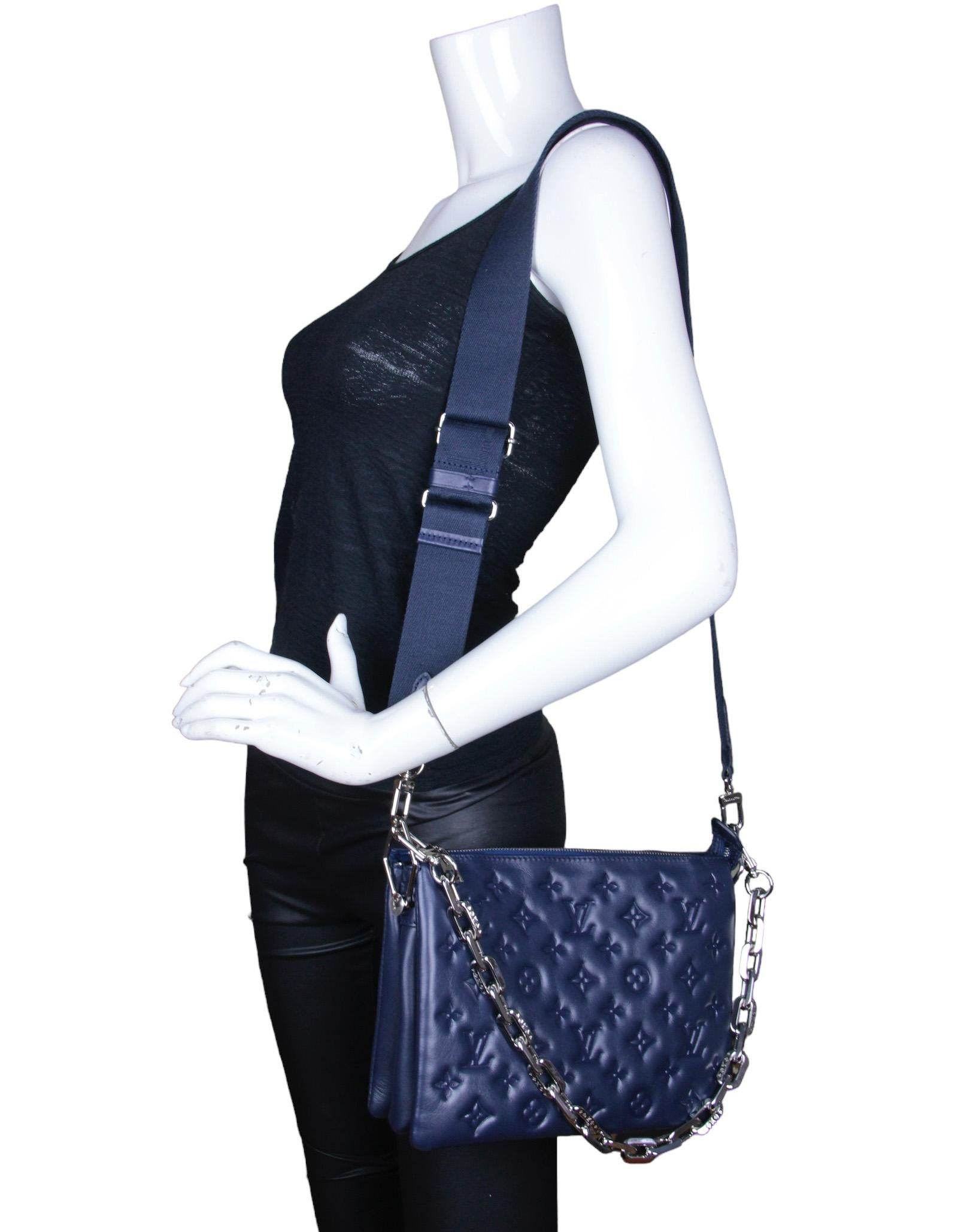 Louis Vuitton Navy Lambskin Leather Embossed Monogram Coussin PM Bag.  Features adjustable canvas strap allowing for crossbody or shoulder carry, and chain strap for baguette and under-arm carry.
Made In: France
Year of Production: 2022
Color: