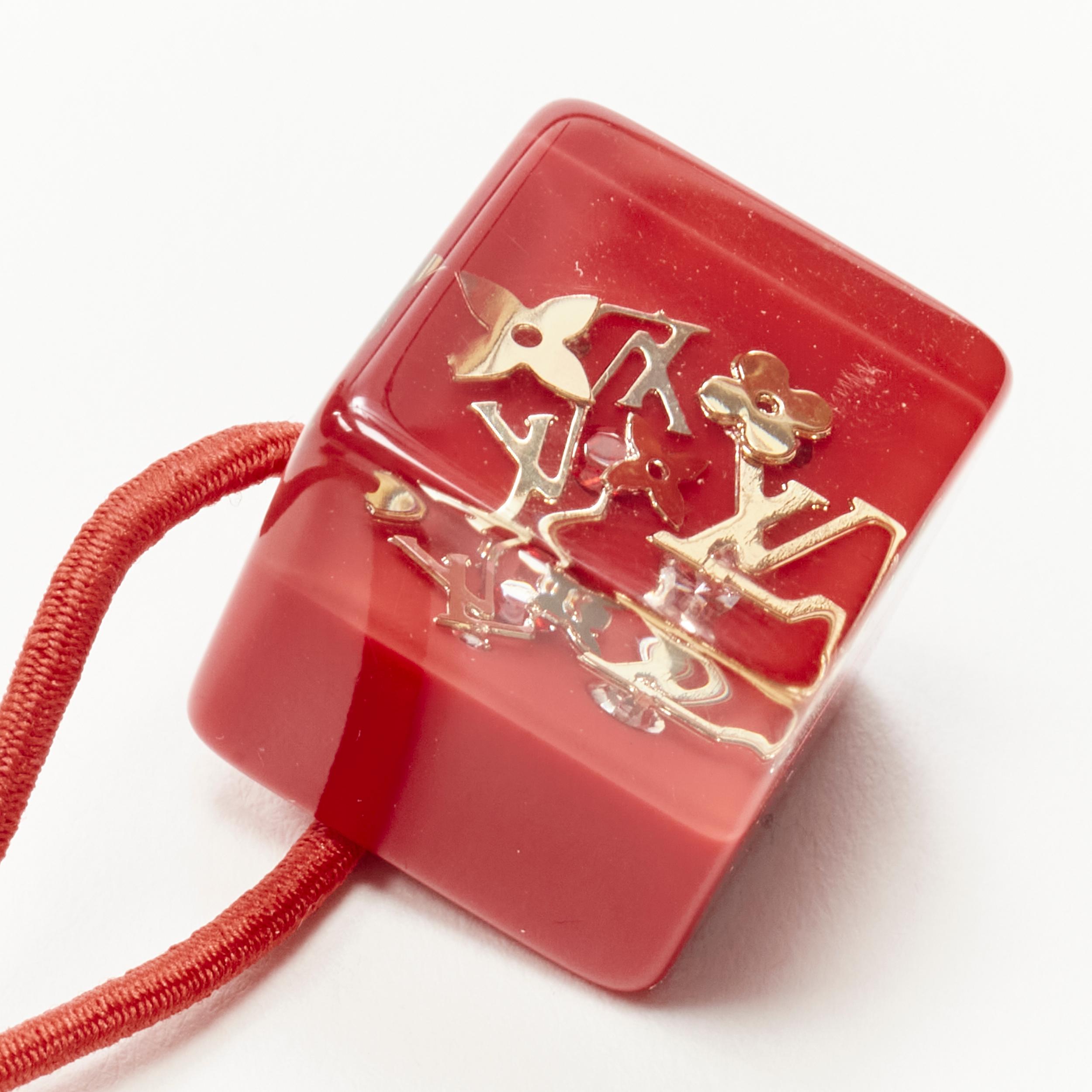 LOUIS VUITTON Burnt Red Elastic Gold LV Hair Cubes at 1stDibs