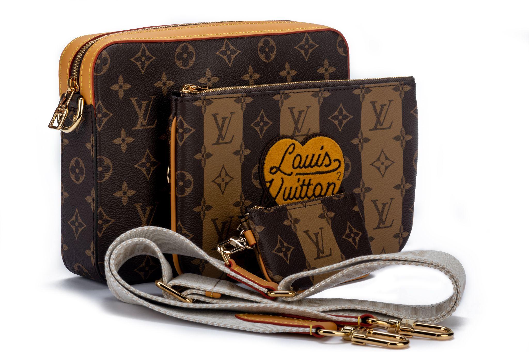 Louis Vuitton Virgil Abloh x NIGO Brown Monogram Stripes Coated Canvas Trio Messenger with Gold Hardware (2021). The bag is lined with black fabric. The piece was featured during the collaboration with Japanese artist Nigo. The piece includes a zip
