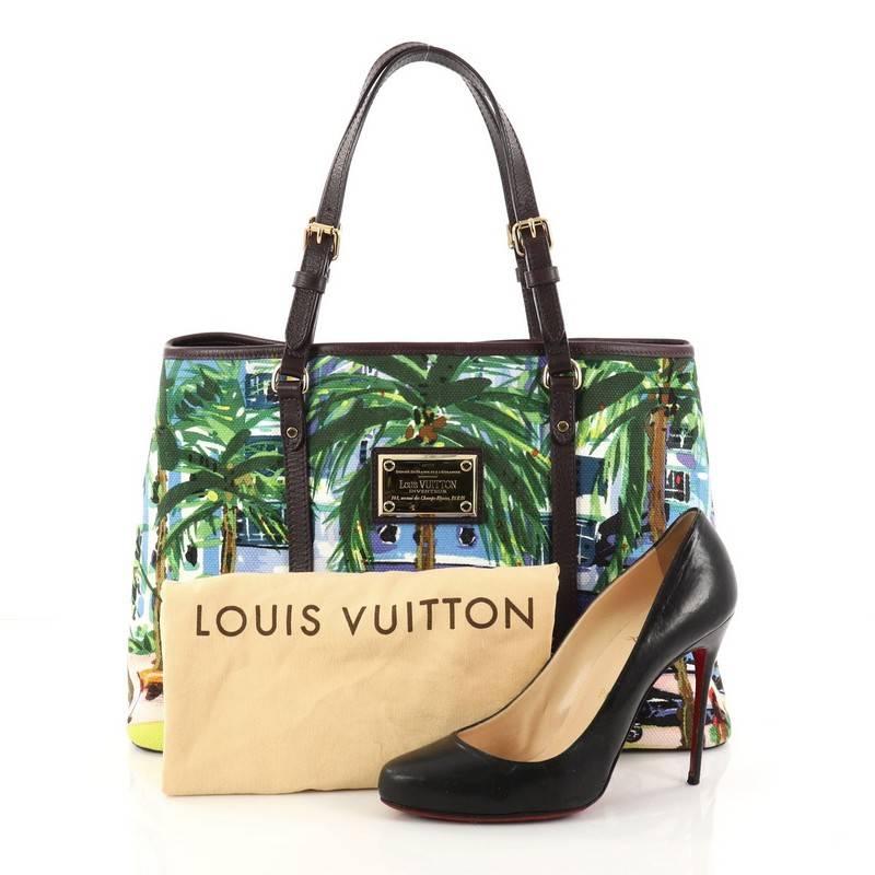 This authentic Louis Vuitton Ailleurs Cabas Limited Edition Printed Canvas PM presented in the brand's 2011 Collection is inspired by the playful and scenic French Riviera destination. Crafted from multicolor printed canvas, this chic and fun tote