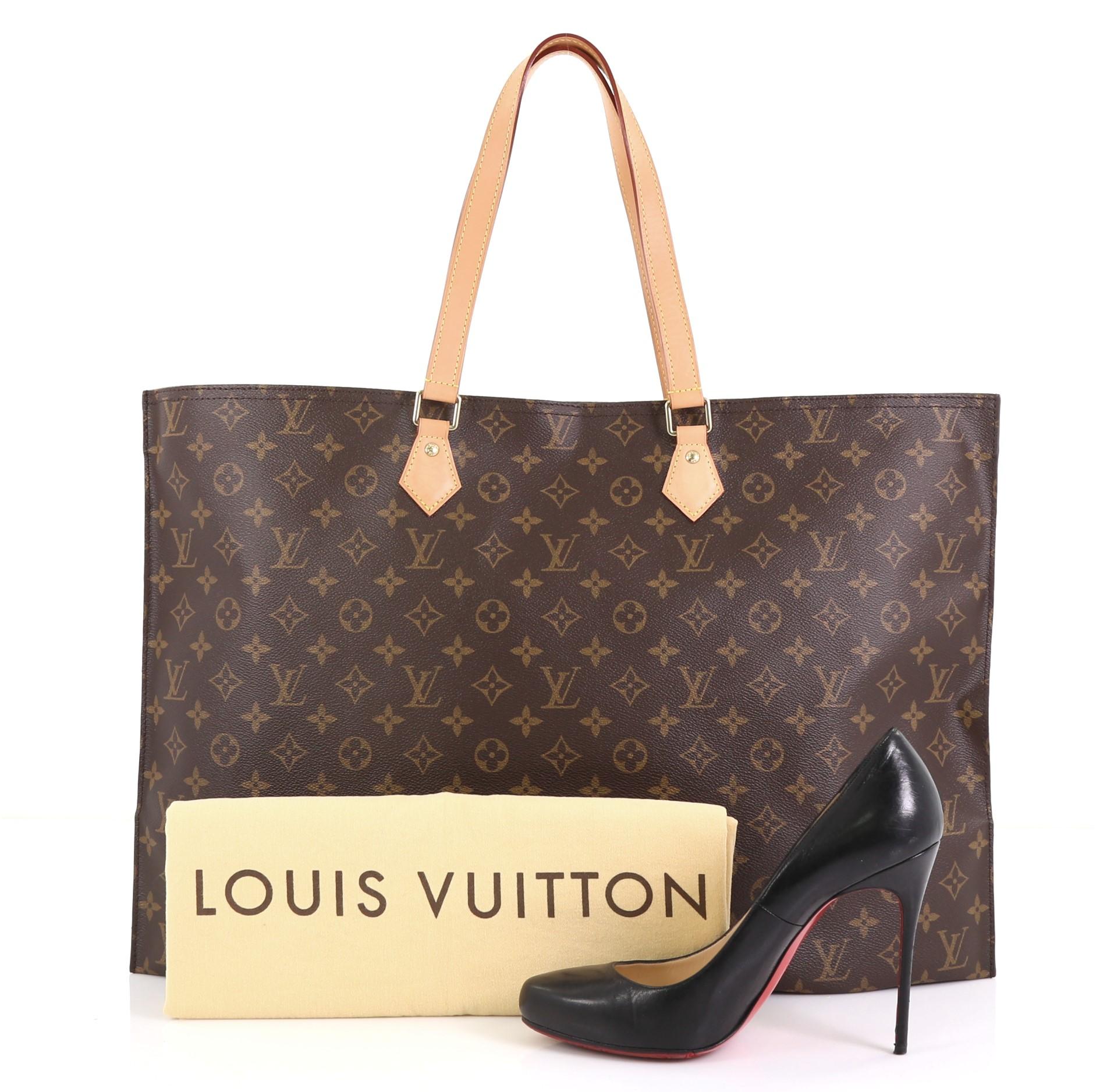 This Louis Vuitton All In Handbag Monogram Canvas GM, crafted in brown monogram coated canvas, features dual flat leather handles and gold-tone hardware. Its zip closure opens to a brown fabric interior with zip pocket. Authenticity code reads: