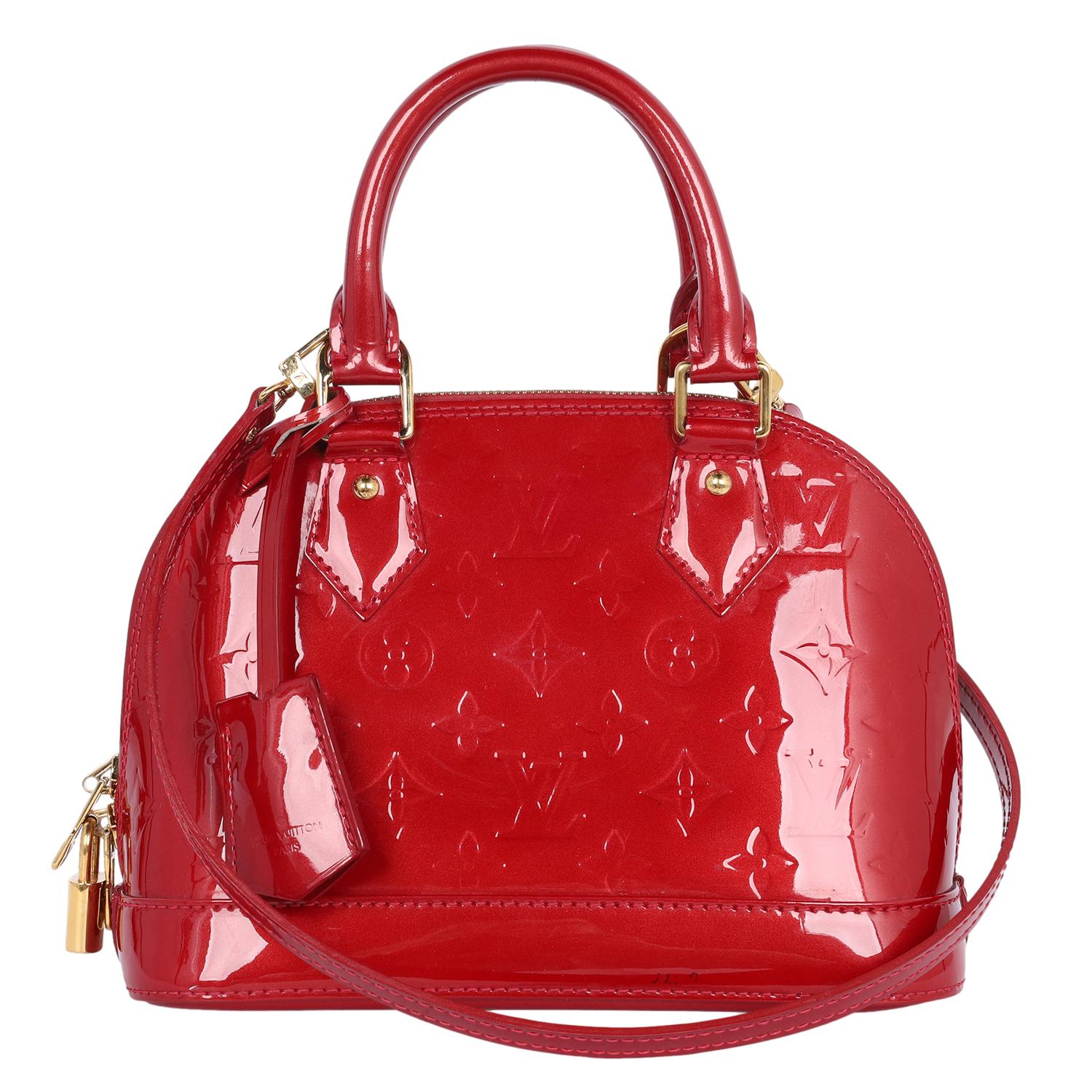 Authentic, pre-owned Louis Vuitton red patent leather Alma BB. The charming Alma BB traces its pedigree to the original Art Deco icon, introduced in 1934. This miniature version easily holds keys, a wallet, a smartphone, and lipstick. With a strap