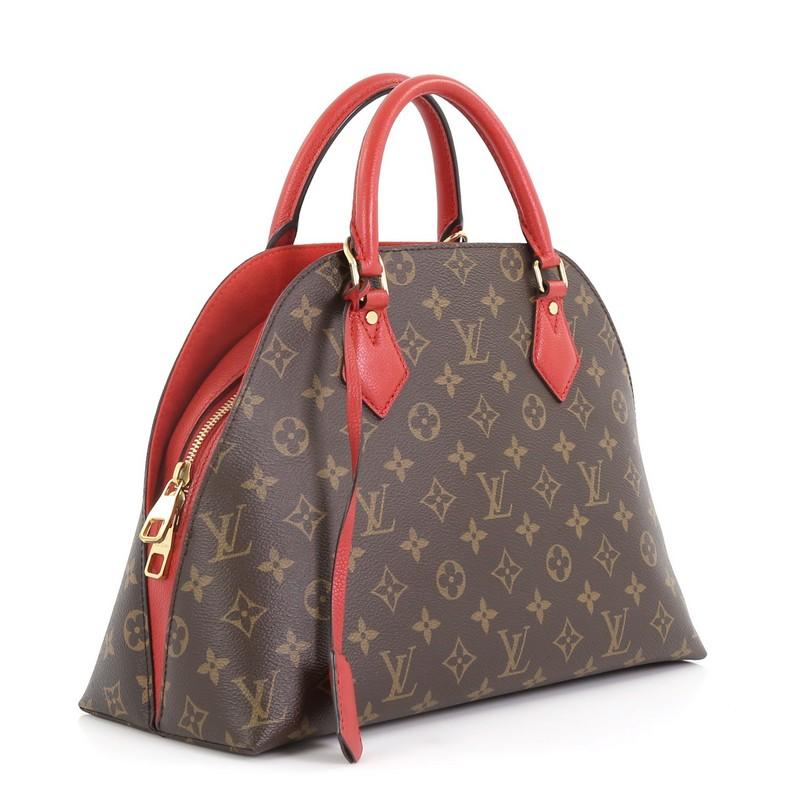 This Louis Vuitton Alma BNB Handbag Monogram Canvas, crafted from brown monogram coated canvas, features dual rolled leather handles, two side exterior compartments, and gold-tone hardware. Its two-way zip closure opens to a red microfiber interior