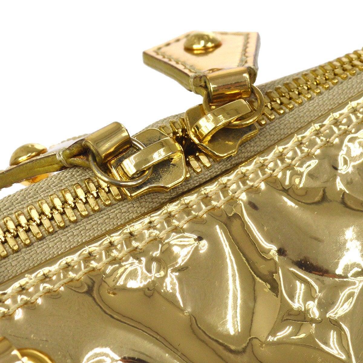 Pre-Owned Vintage By Zustand
Aus der Collection'S 2008
Vinyl
Goldfarbene Hardware 
Gewebte Auskleidung
Maße: 15,5