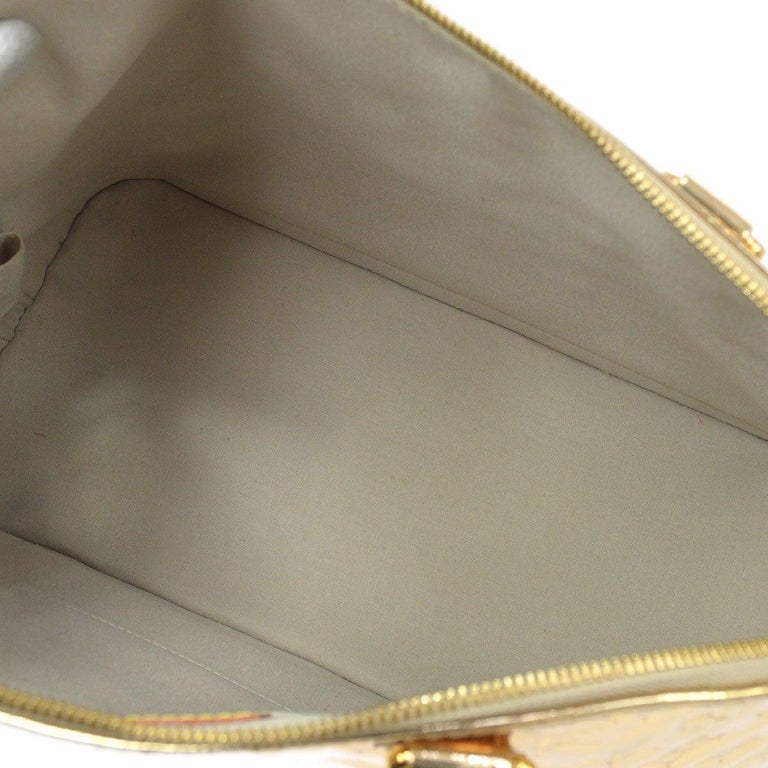 LOUIS VUITTON Alma Gold Monogram Vinyl Mirror Gold Hardware Top Handle Tote  Bag For Sale at 1stDibs