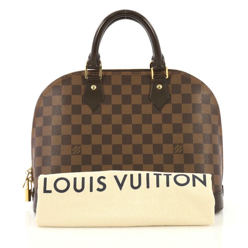 This Louis Vuitton Alma Handbag Damier PM, crafted from damier ebene coated canvas, features dual rolled handles, leather trim, and gold-tone hardware. Its two-way zip closure opens to a red fabric interior with slip pockets. Authenticity code