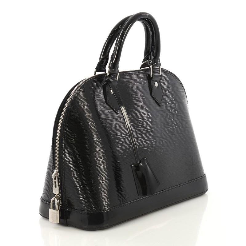 This Louis Vuitton Alma Handbag Electric Epi Leather PM, crafted with black electric epi leather, features dual rolled handles, dome-like silhouette, protective base studs, and silver-tone hardware. Its zip around closure opens to a black microfiber