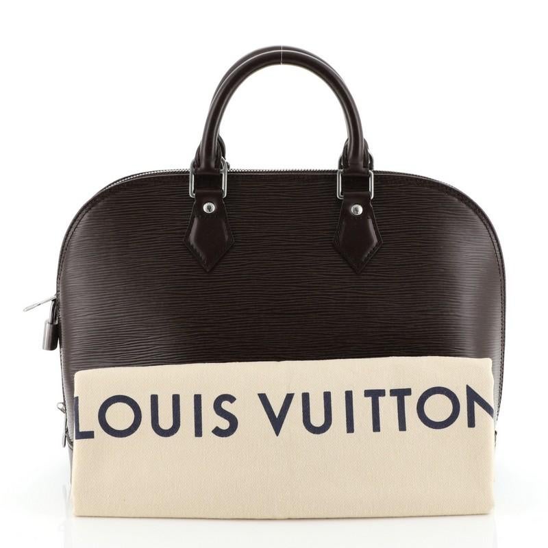 This Louis Vuitton Vintage Alma Handbag Epi Leather PM, crafted in brown epi leather, features dual rolled leather handles, and matte silver-tone hardware. Its all-around zip closure opens to a brown microfiber interior with slip pockets.