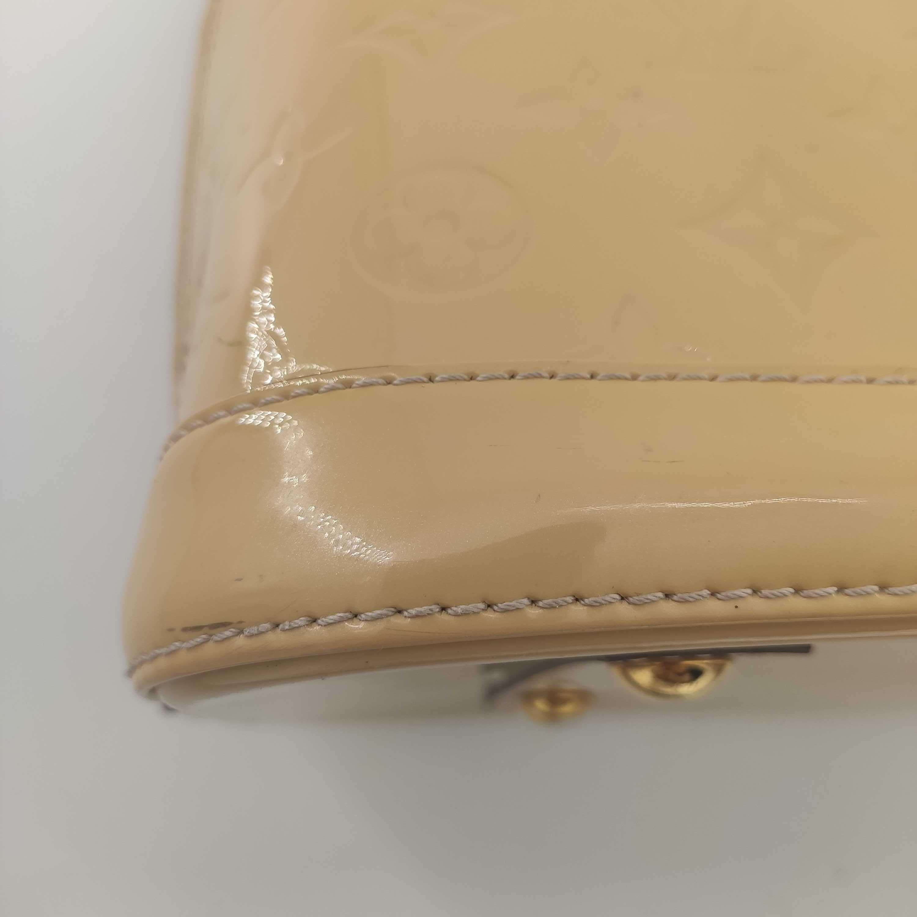 LOUIS VUITTON Alma Handbag in Beige Leather 9