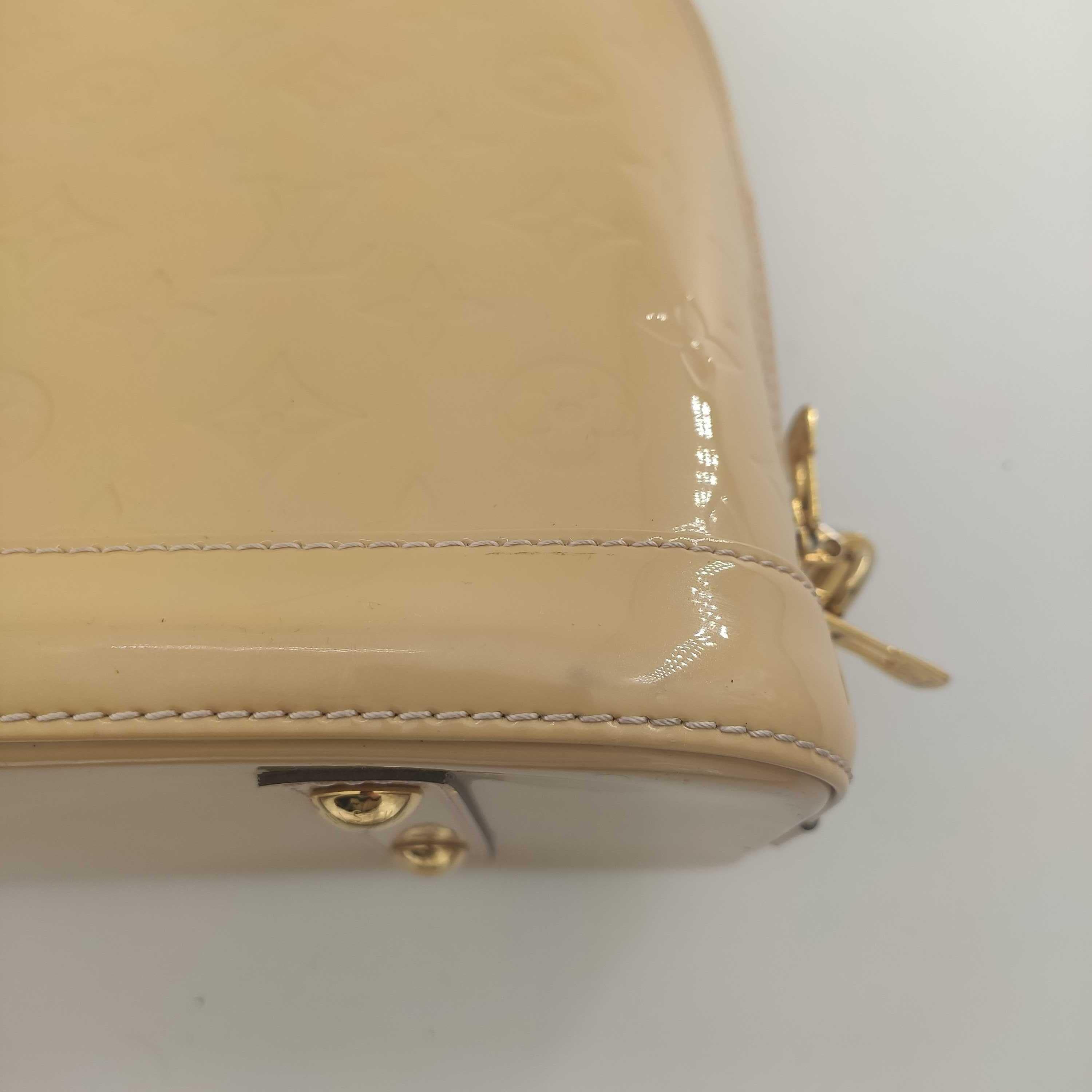 LOUIS VUITTON Alma Handbag in Beige Leather 10