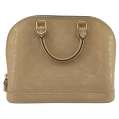 LOUIS VUITTON Alma Handbag in Beige Leather