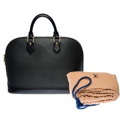 Louis Vuitton Alma handbag in black épi leather with gold hardware