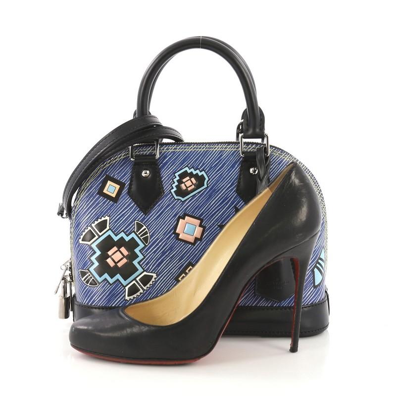 This Louis Vuitton Alma Handbag Limited Edition Azteque Epi Leather BB, crafted in blue Azteque epi leather, features dual rolled handles, black leather base, protective base studs and silver-tone hardware. Its zip-around closure opens to a black