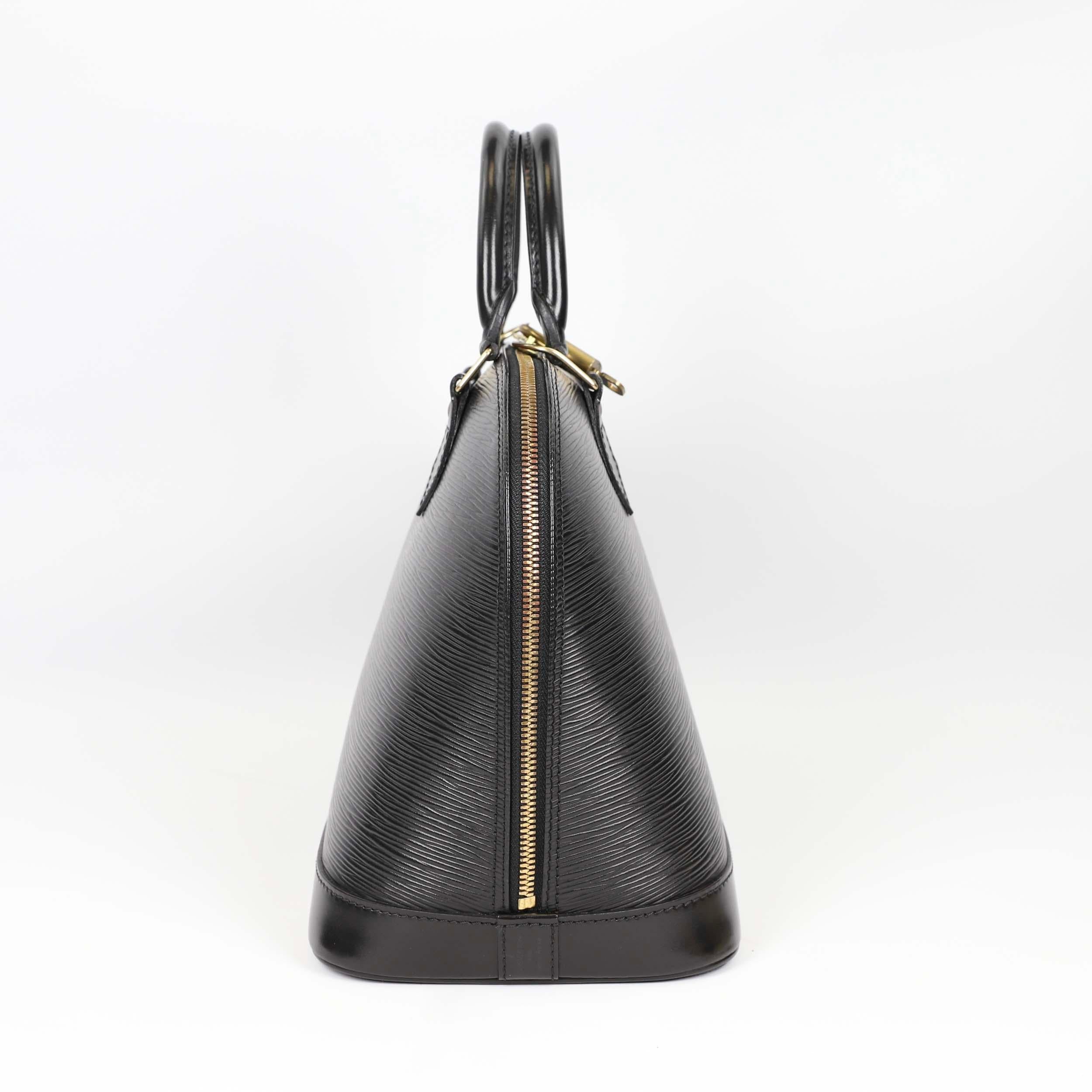 Louis Vuitton Alma leather handbag 9