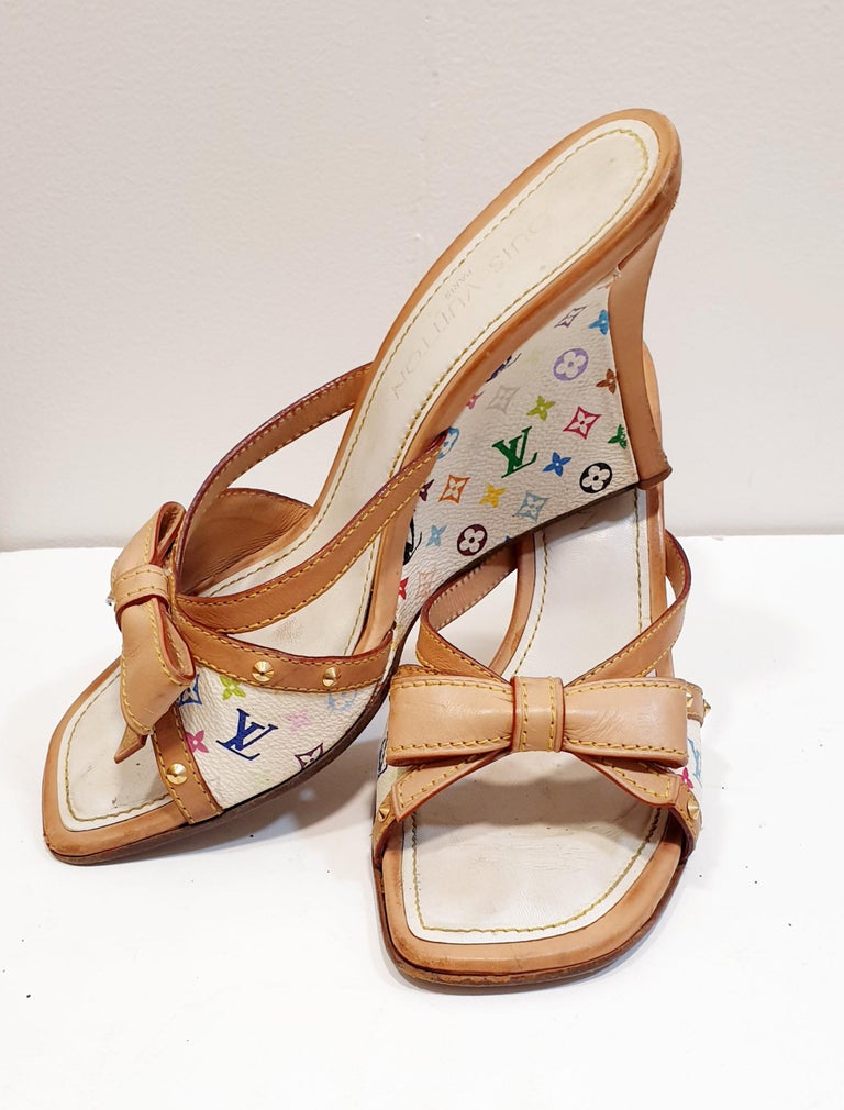 Louis Vuitton Multicolor Alma Monogram  Sandals Wedges
Authentic Gorgeous 100% genuine Louis Vuitton white multicolor logo wedges.These shoes feature signature coated Multicolore canvas and natural cowhide trim, complete with bows on each shoe and