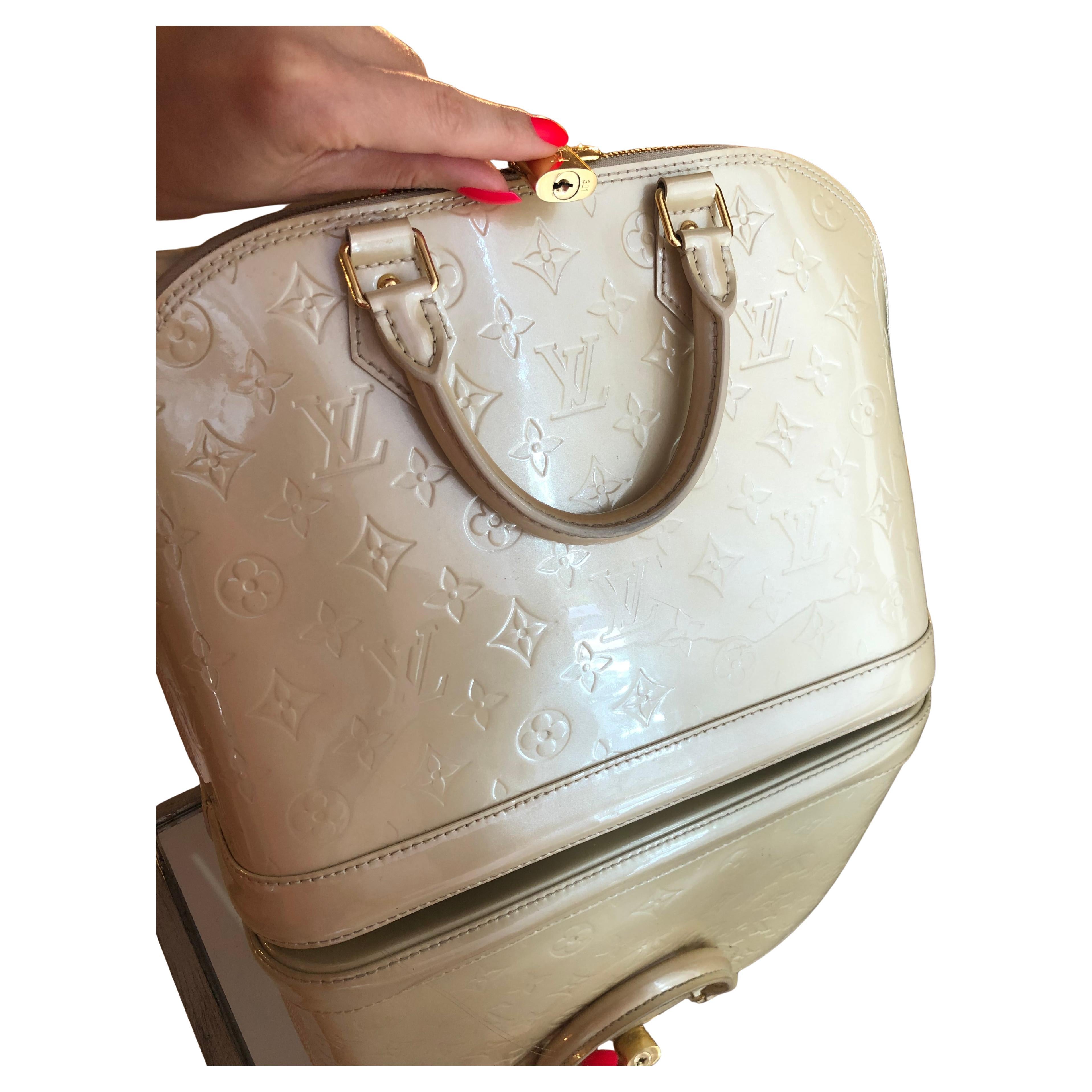 Louis Vuitton Alma PM Bag. Patent beige leather. 
Very good condition,has little marks where handles drop. Refer to the pictures.Comes with dust bag only.