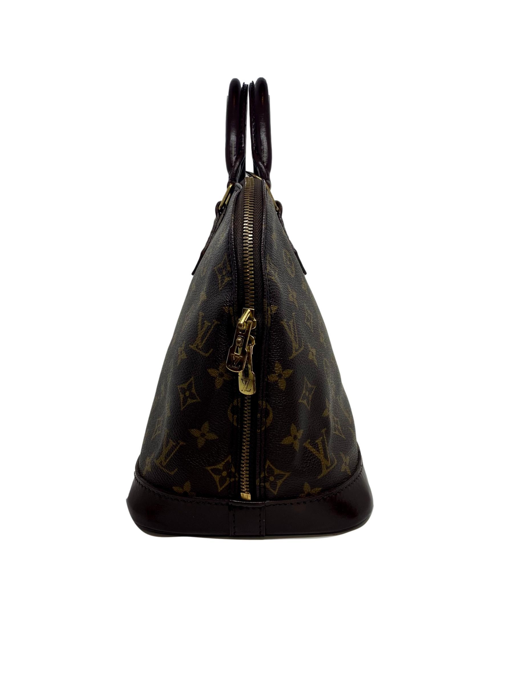 Black Louis Vuitton Alma PM Monogram Top Handle Handbag, France 1994. 