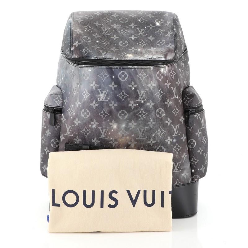 This Louis Vuitton Alpha Backpack Limited Edition Monogram Galaxy Canvas, crafted in purple printed monogram coated canvas, features adjustable backpack straps, two exterior side pockets and black-tone hardware. Its zip closure opens to a black