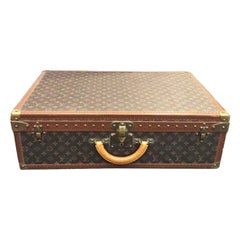 Suitcase Louis Vuitton Alzer 60 cm - Les Puces de Paris Saint-Ouen