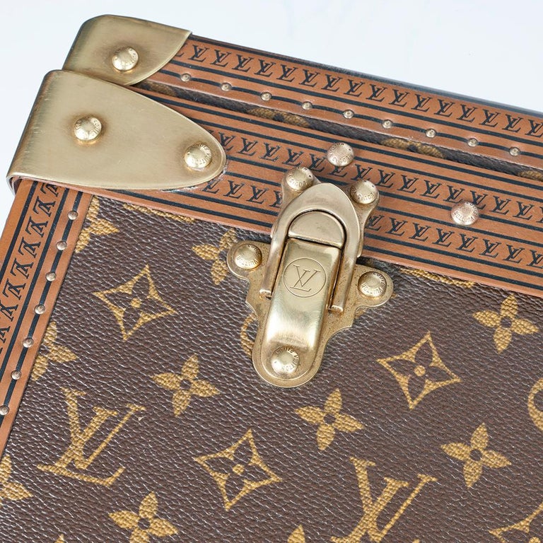 Lot - A Louis Vuitton leather and monogram canvas Alzer 80 hard sided  suitcase, 20th century