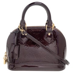 LOUIS VUITTON Vintage red Cotton Fabric Monogram Mini Lin Alma Long  Handbag.Very good condition. Website search for…