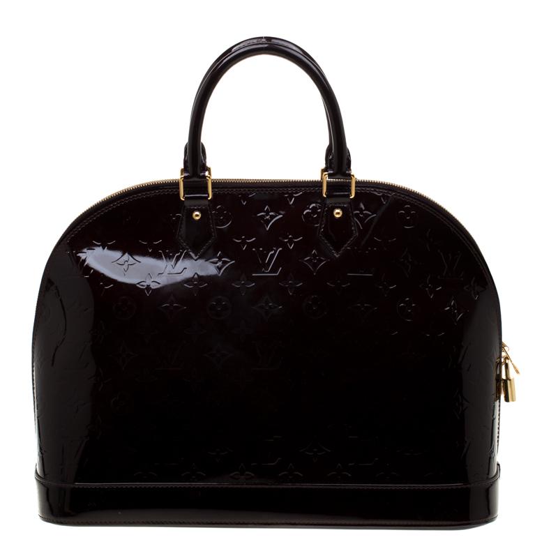 A classic from the house of Louis Vuitton, the shape of the Alma stands out. Louis Vuitton Alma was named after the Alma Bridge that connects Paris's fashionable neighborhood. The bag is made from the signature Monogram Vernis patent leather that