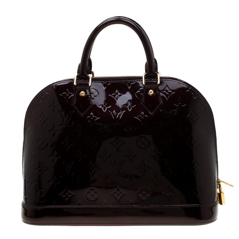 A classic from the house of Louis Vuitton, the shape of the Alma stands out. Louis Vuitton Alma was named after the Alma Bridge that connects Paris's fashionable neighborhood. The bag is made from signature Monogram Vernis that was introduced in