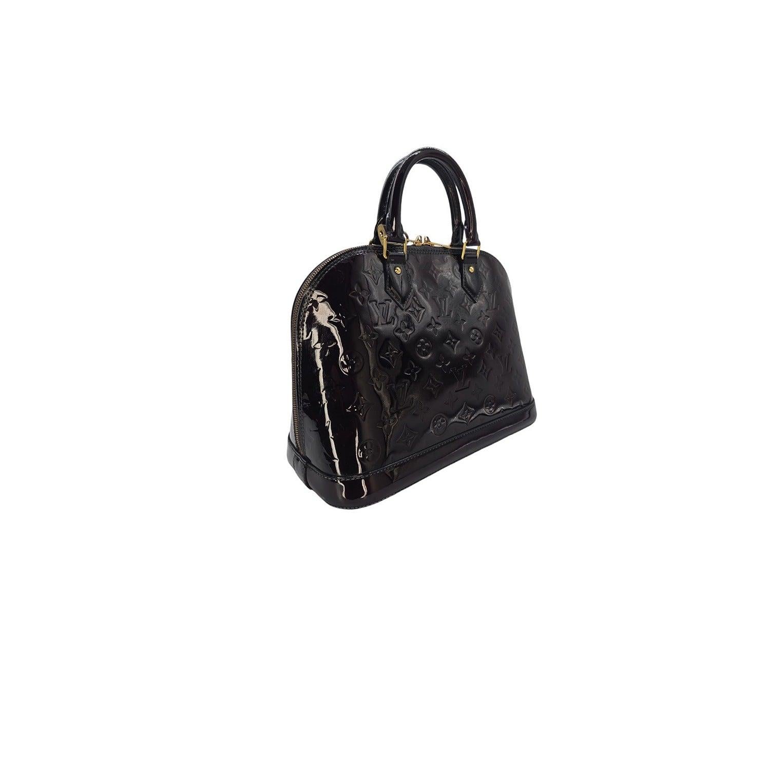 Elevate your style with the Louis Vuitton Monogram Vernis Alma PM bag. Handcrafted in France with burgundy colored patent leather and gold-tone hardware, it exudes sophistication and luxury. With a spacious interior and protective studs at the base,
