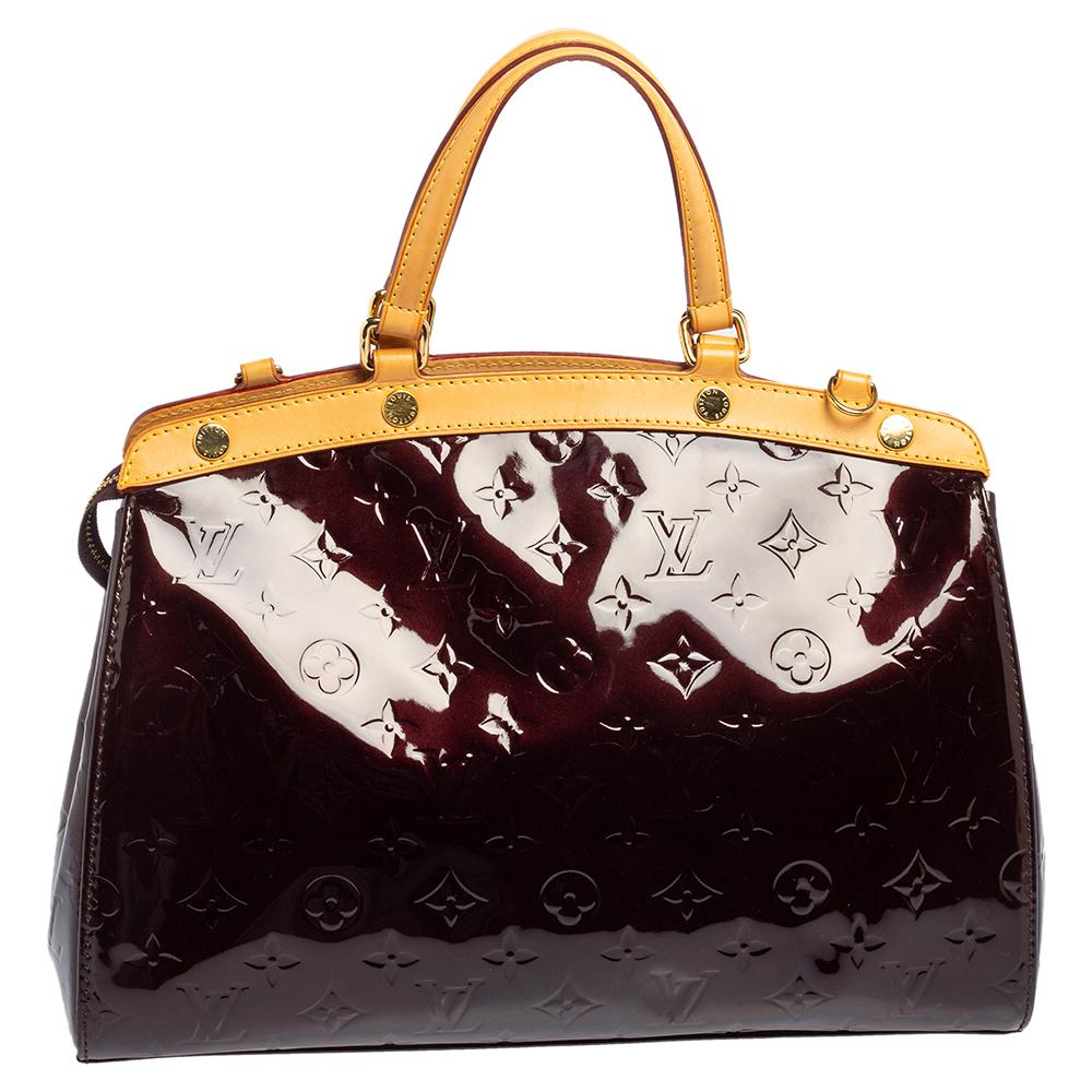 The feminine shape of Louis Vuitton's Brea is inspired by the doctor's bag. Crafted from Monogram Vernis, the bag has a perfect finish. The fabric interior is spacious and it is secured by a zipper. The bag features double handles, protective metal