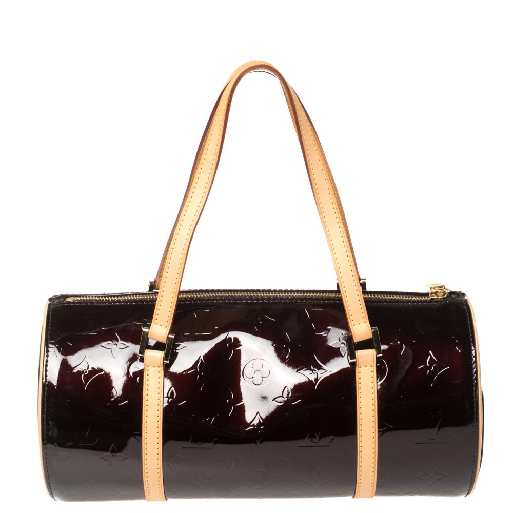 Another classic from the house of Louis Vuitton is this beautiful Bedford. The burgundy bag is made from Monogram Vernis leather, lending it durability. In shape, it resembles their famous Papillon bag but of course, the Bedford has a unique feel of