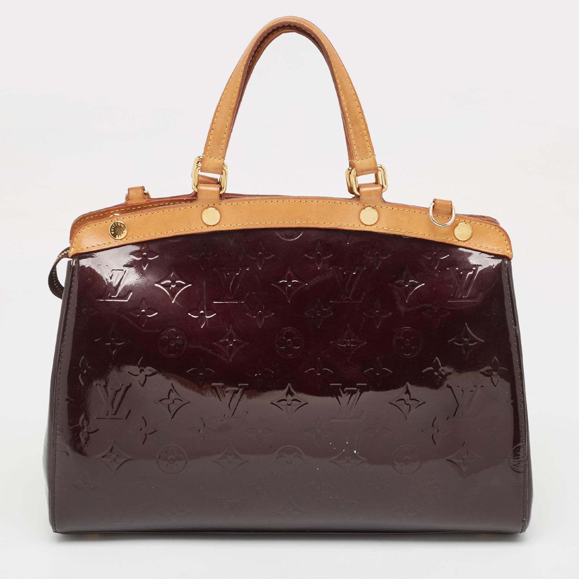 A creation that is both highly functional and appealing is the Brea by Louis Vuitton. Crafted from Monogram Vernis, this bag is held by dual handles and equipped with a spacious interior to hold your essentials with ease.

Includes: Detachable Strap